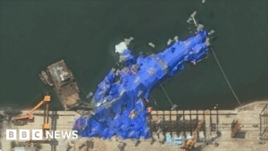 North Korea detains three officials over warship launch accident, state media says