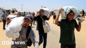 Palestinians say local gunmen and Israeli forces opened fire near Gaza aid site